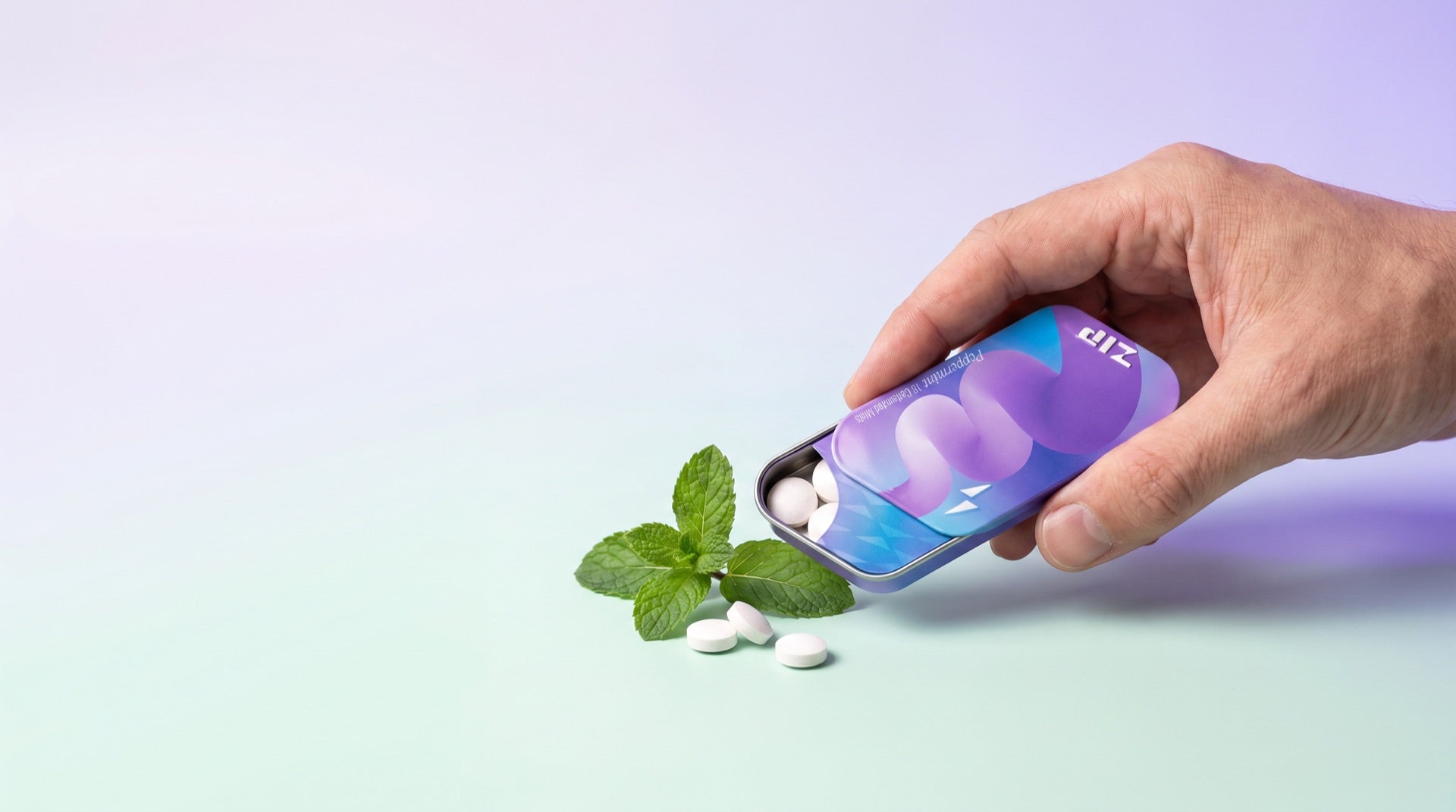 Zip Mints — Peppermint tin held in hand