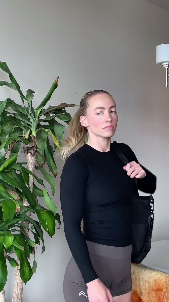 Woman grabbing Zip from her gym bag before a workout